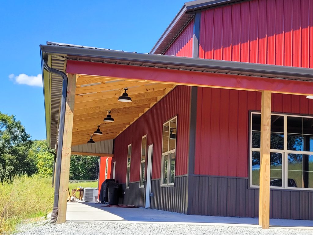 Rustic red metal siding with a burnished slate metal roof ideal structures 4
