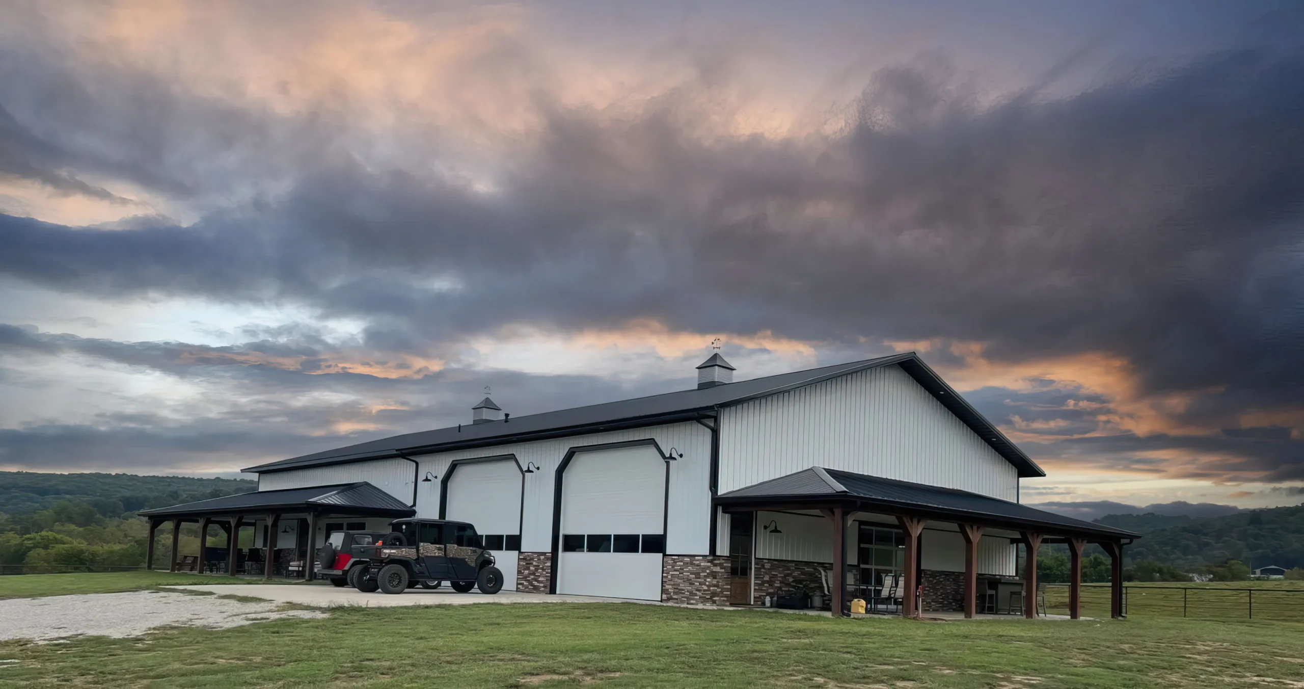 black standing seam metal roof in fayetteville arkansas with a rock chimney