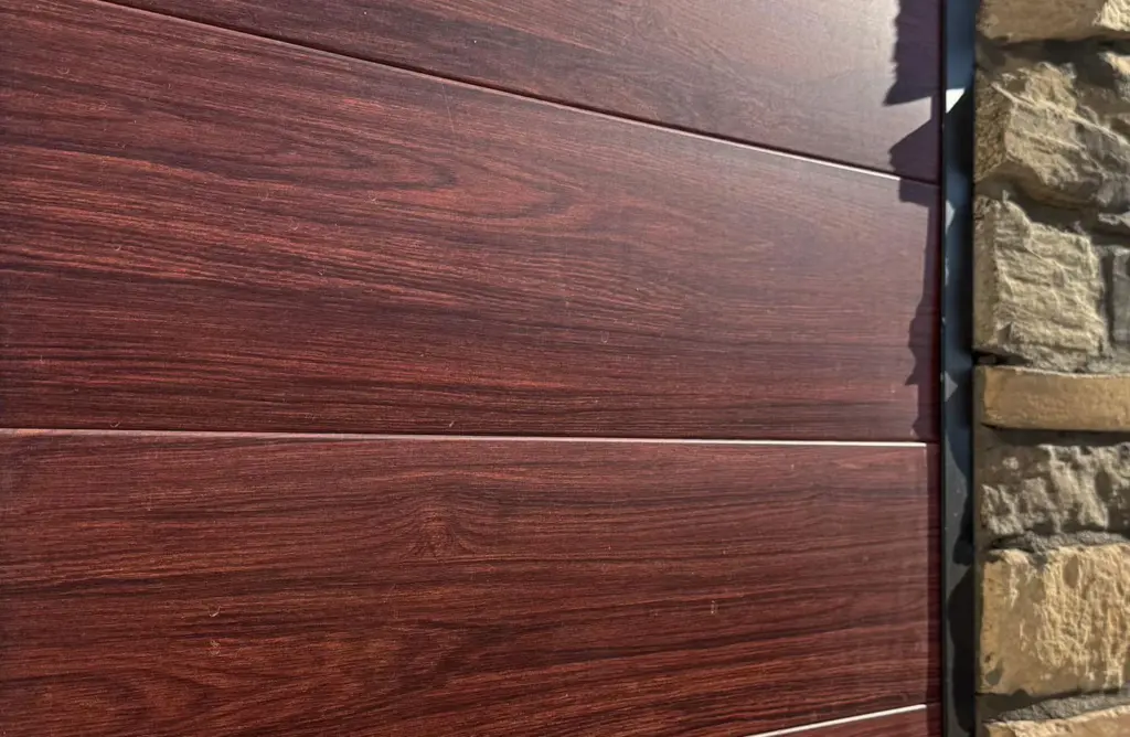 Dark cherry metal flush panels installed on an exterior office wall