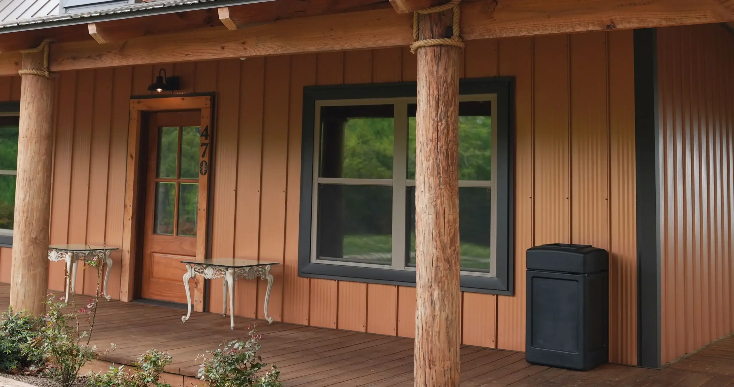 Copper colored signature wave metal from Signature Steel installed on the lodge at Ponderosa Mountain Venue in Northwest, AR.