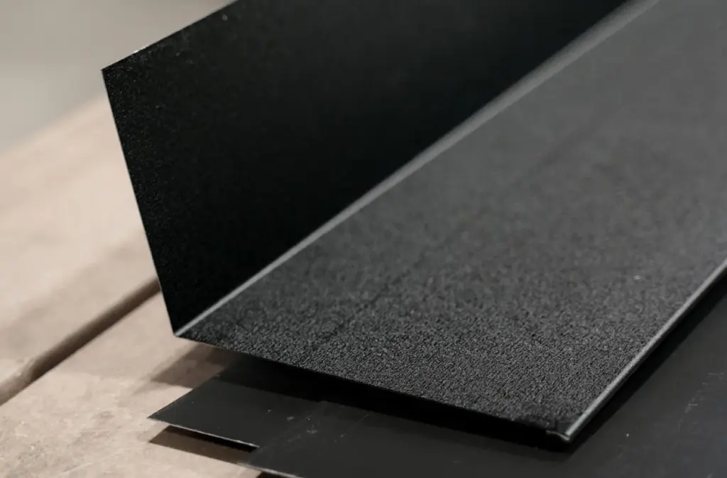 a close up view of black metal trim from signature steel.